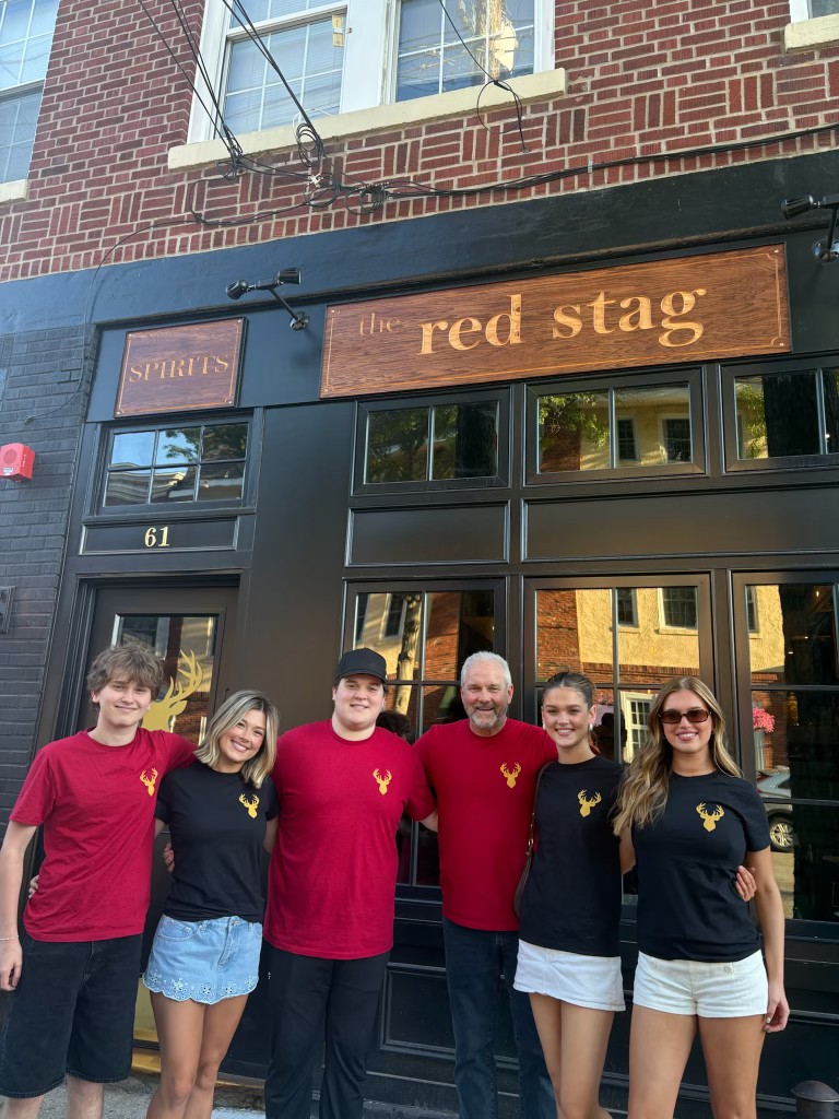 The owner of The Red Stag with his family