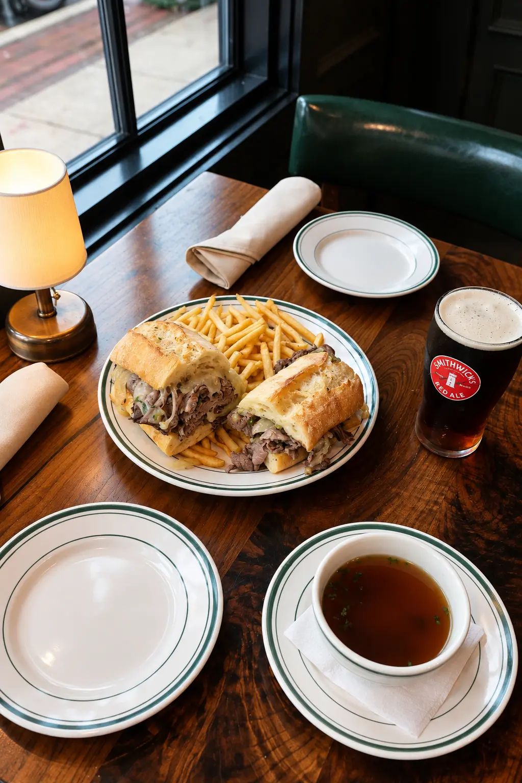 French dip and au jus at a window table in the dining room